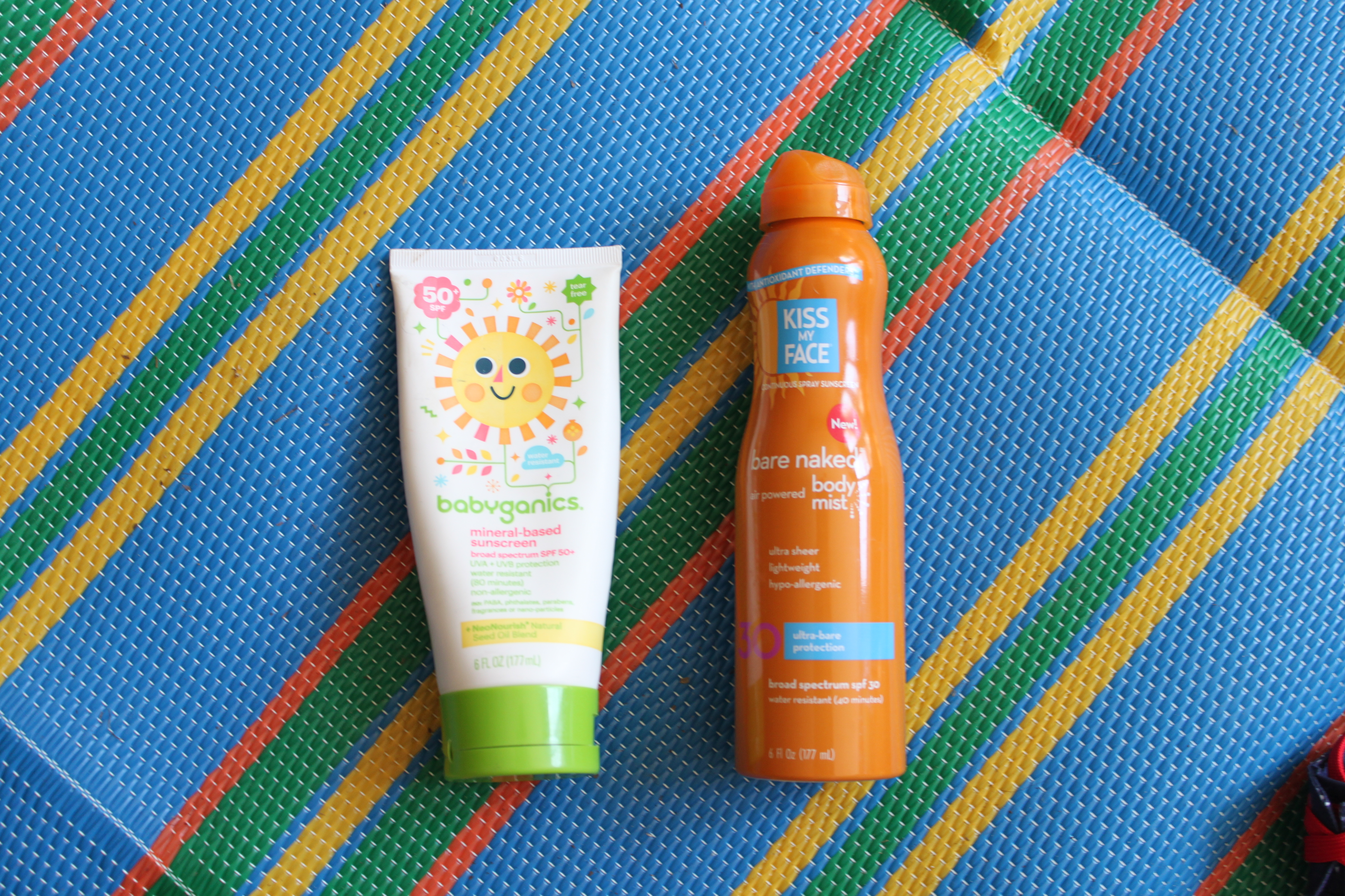 summer essentials for mom and toddler for parks, beach, and pool. Sunscreen, skin and hair products. Kiss the Face Sunscreen and Babyganics