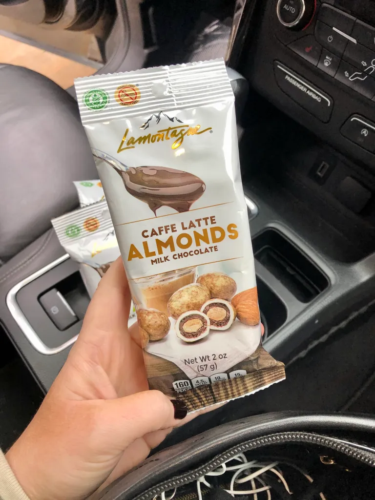 Lamontagne chocolate is peanut free and Kosher with around 160 calories a pack (2oz). A better alternative for all other snacks you might take with you on the road!  
