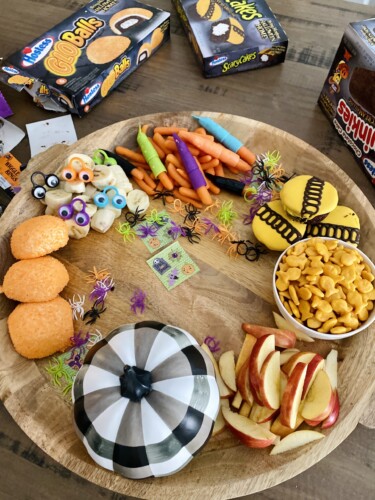 Halloween snack board is fun to make for the kids this holiday. Add your favorite snacks, sweets and treats! 