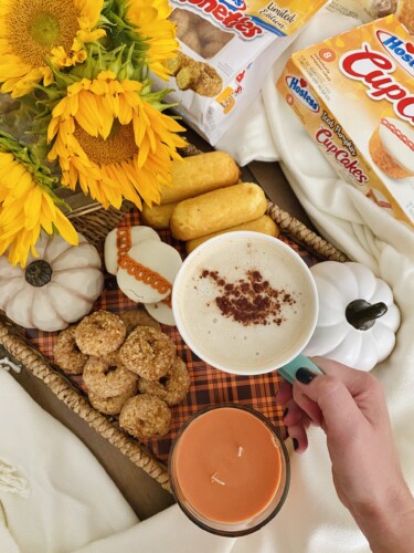 Pumpkin spice coffee with a fall snack board