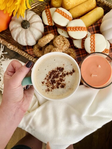 Pumpkin spice coffee with a fall snack board