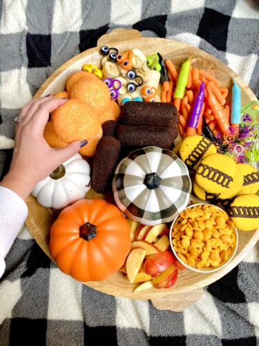 Halloween snack board is fun to make for the kids this holiday. Add your favorite snacks, sweets and treats! 