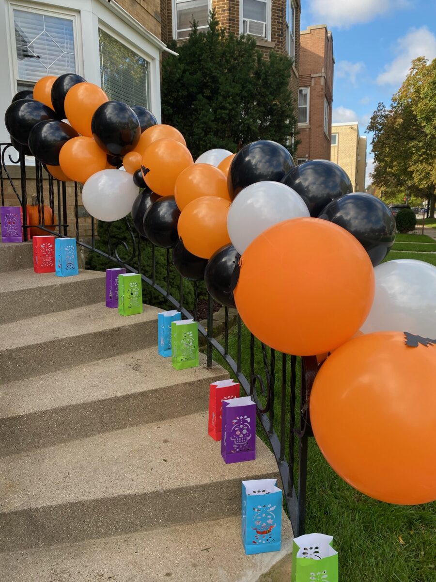 Hosting a Halloween party at home with balloons and luminary bags